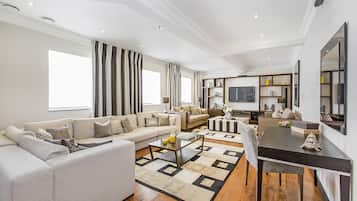 Penthouse Suite, Four Bedrooms Apartment | Living room | LCD TV, DVD player, iPod dock