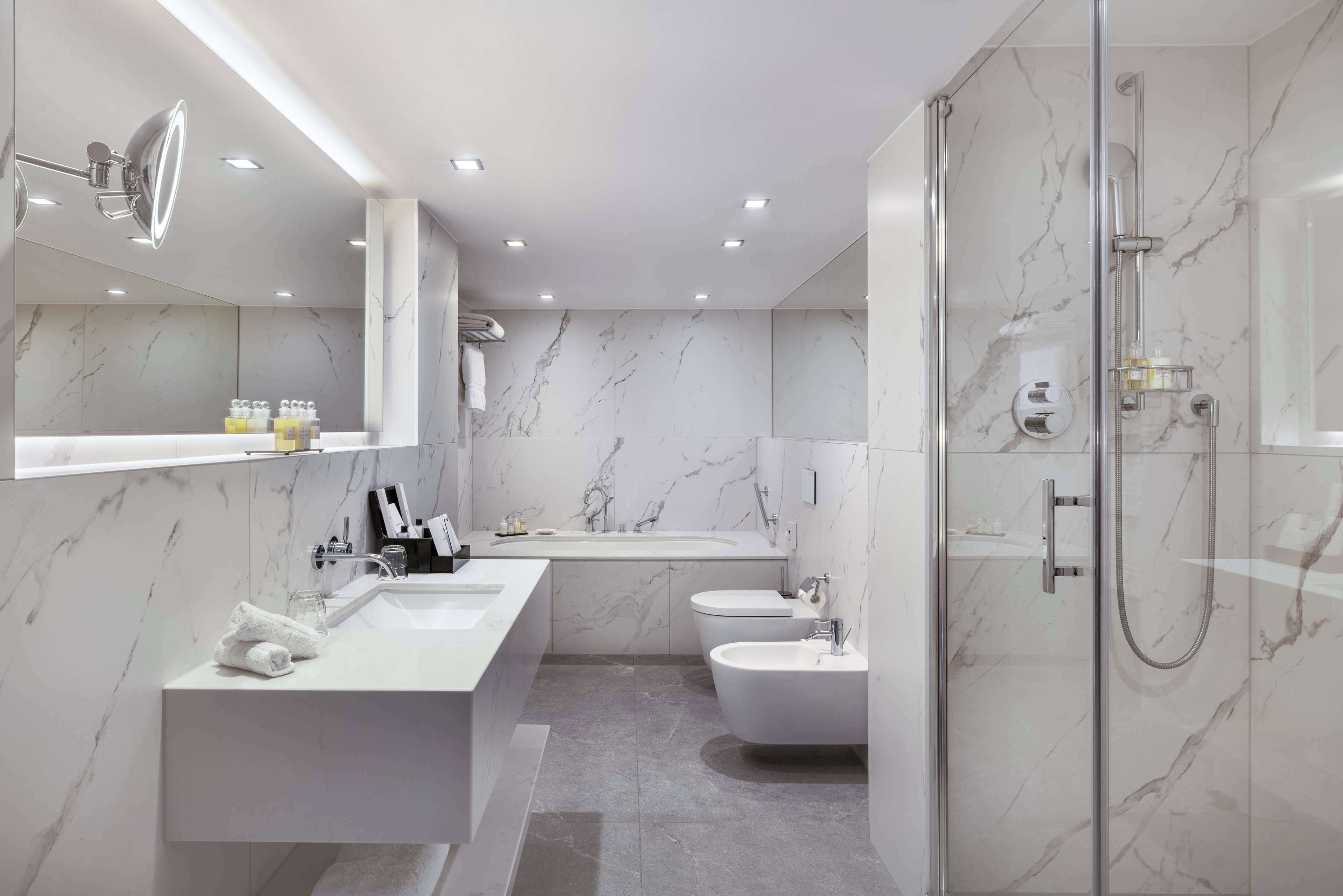 master suite | bathroom | combined shower/bathtub, rainfall showerhead, designer toiletries