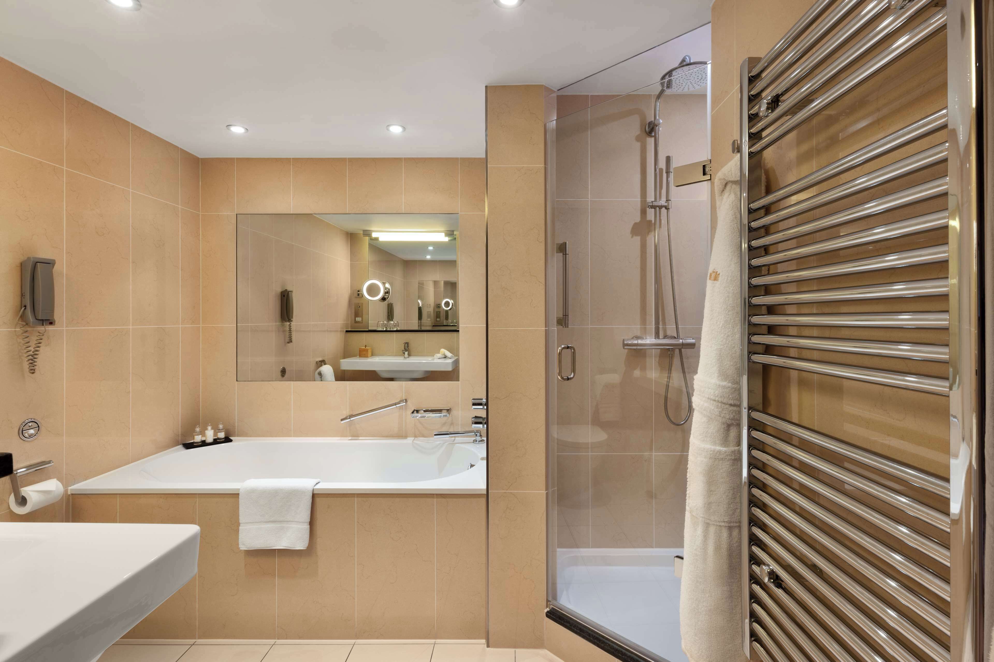 combined shower/bathtub, rainfall showerhead, designer toiletries