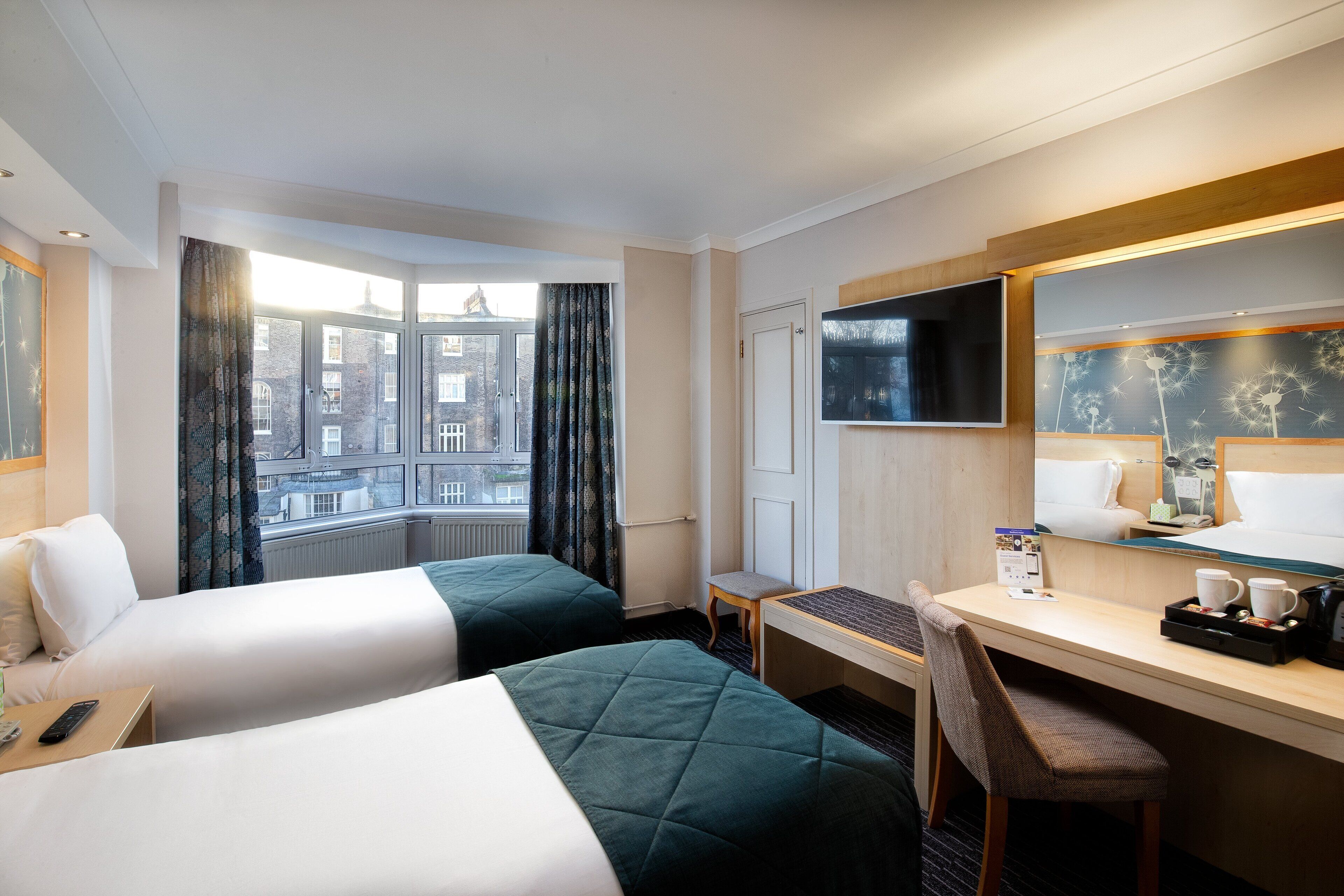 twin room, garden view | 1 bedroom, in-room safe, desk, iron/ironing board