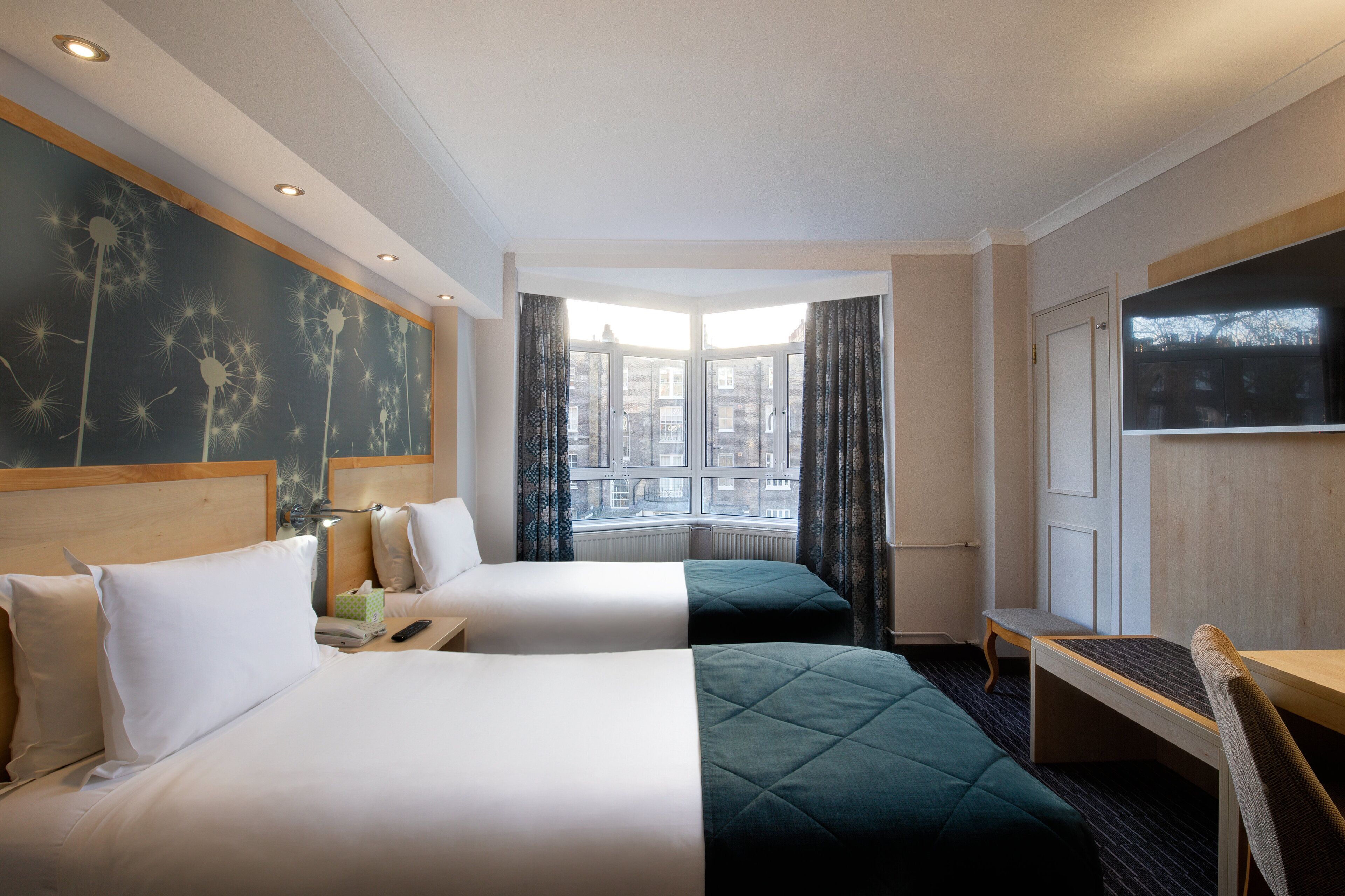 twin room, garden view | 1 bedroom, in-room safe, desk, iron/ironing board