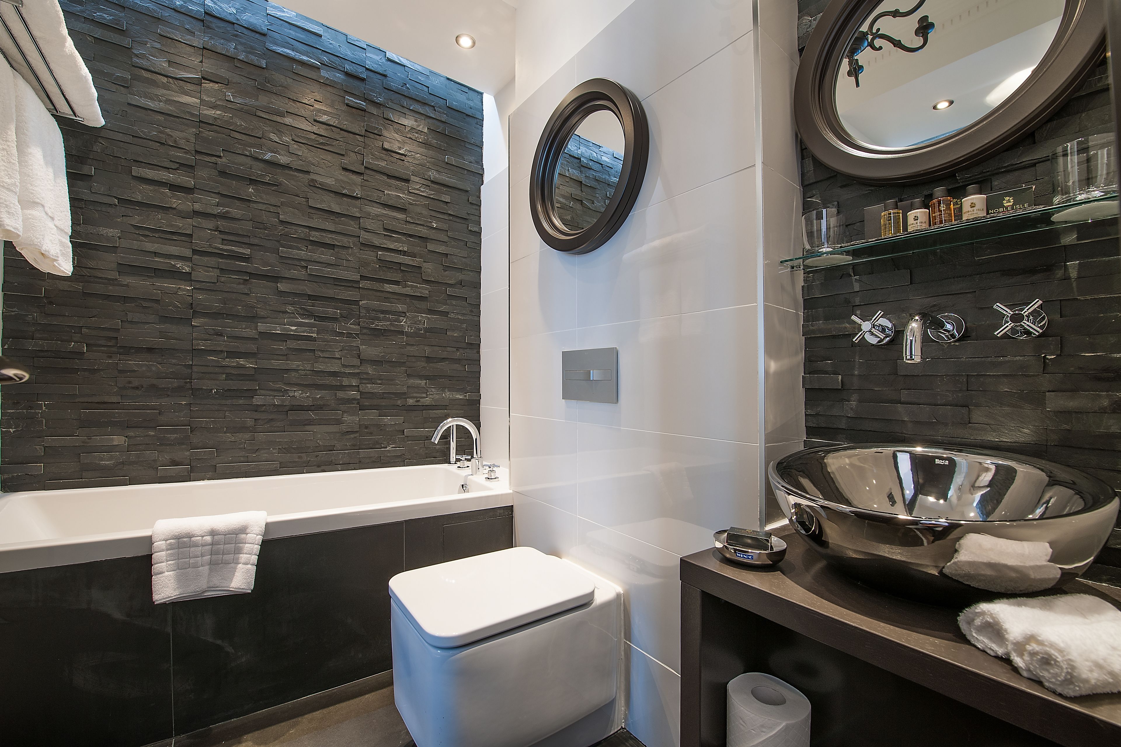 separate bathtub and shower, rainfall showerhead, designer toiletries