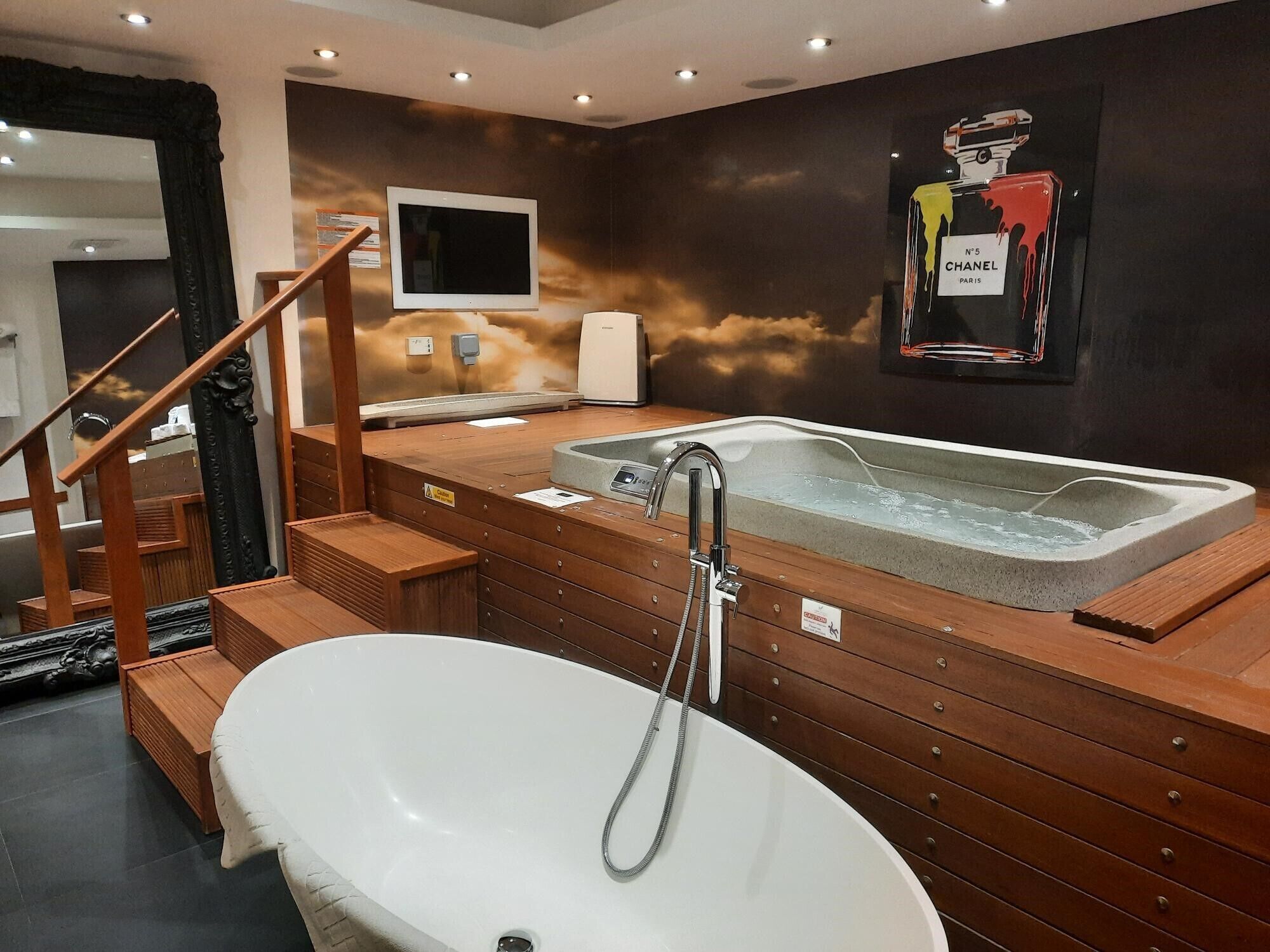 separate bathtub and shower, rainfall showerhead, designer toiletries