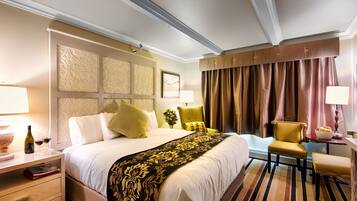 Desk, blackout drapes, iron/ironing board, bed sheets