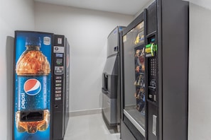 A vending machine with a Pepsi logo and a digital calorie counter. - Best Western Plus Executive Inn (St. Marys)