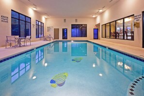 An indoor swimming pool with clear water, a lifeguard sign, and a no diving sign. - Holiday Inn Express Ringgold by IHG (Ringgold)