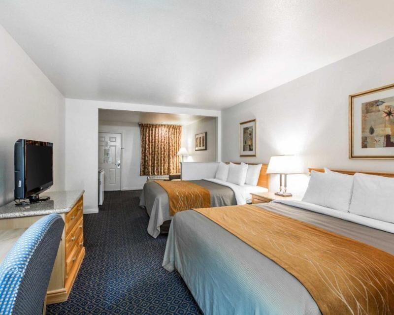 Desk, blackout drapes, iron/ironing board, rollaway beds