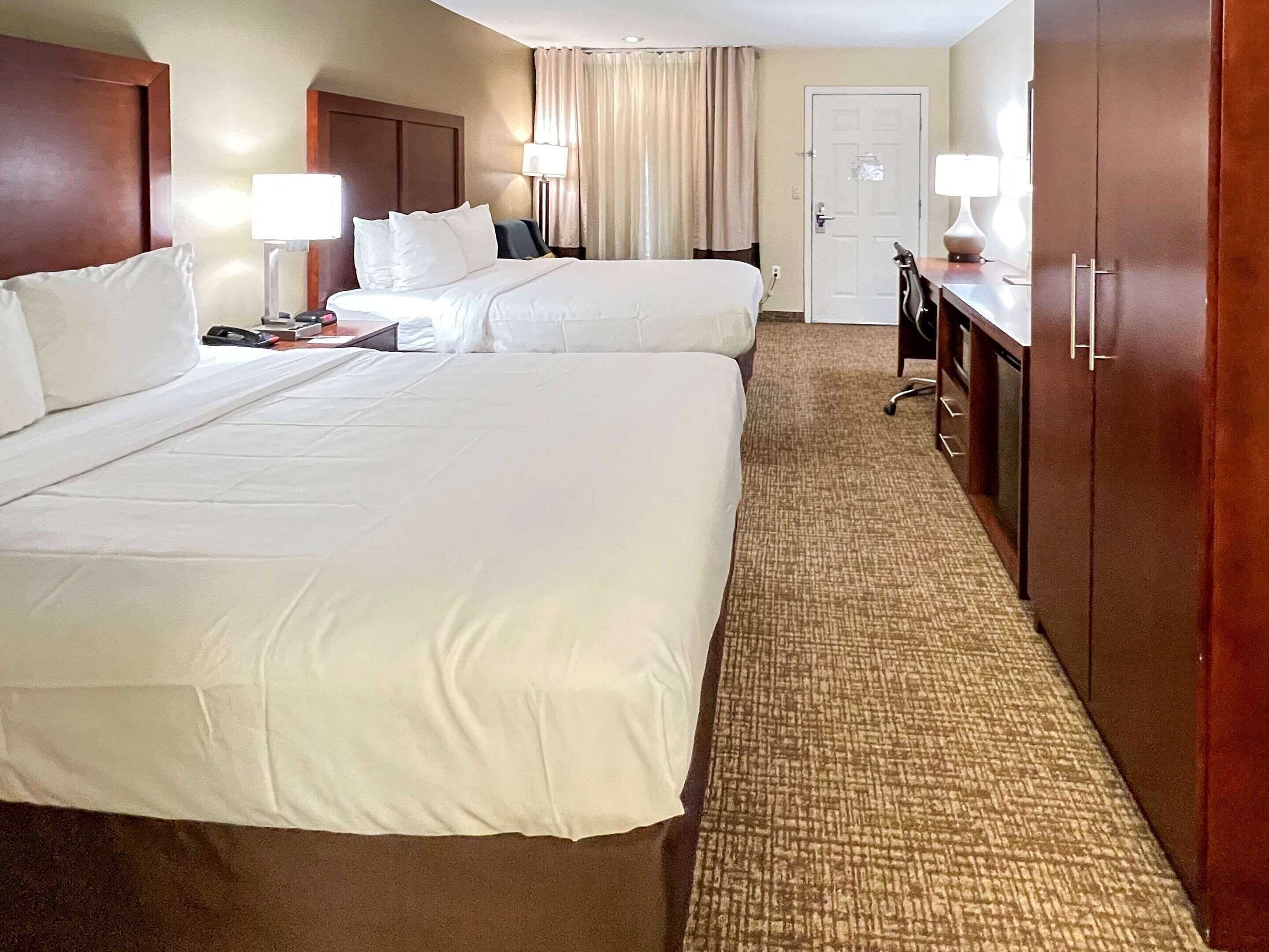 Desk, blackout drapes, iron/ironing board, rollaway beds