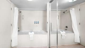 Standard Room, 1 King Bed, Non Smoking, Jetted Tub | Bathroom | Combined shower/tub, hair dryer, towels, soap
