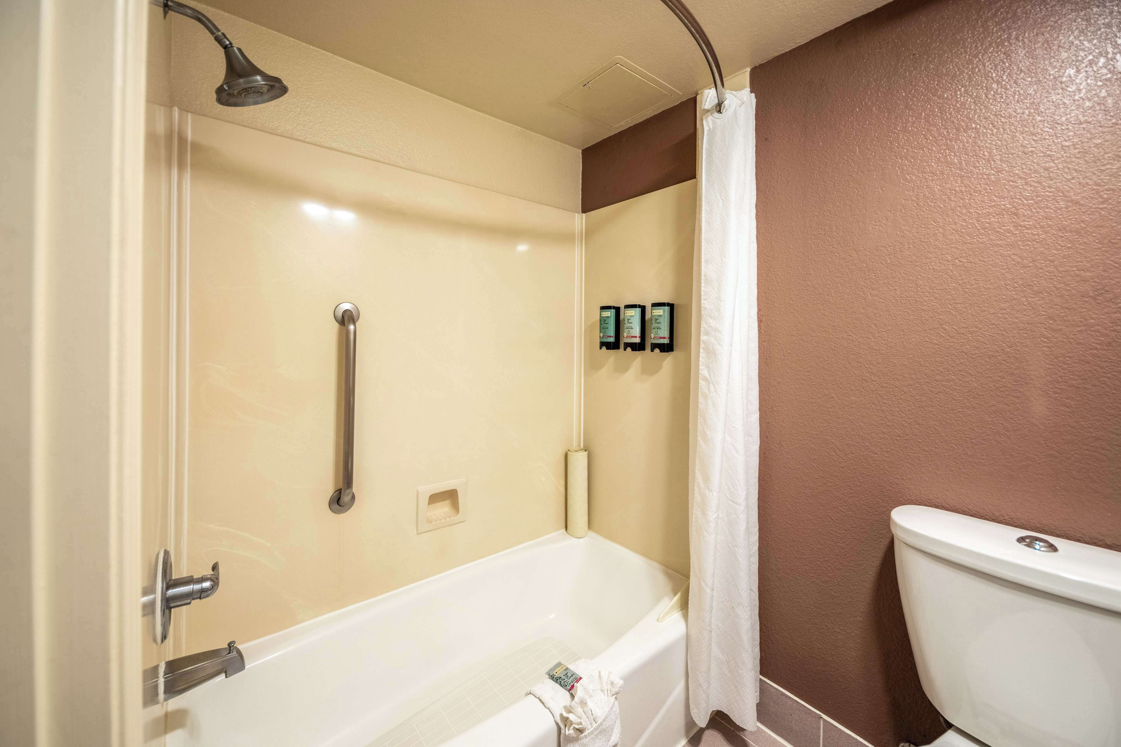 combined shower/bathtub, hair dryer, towels, soap