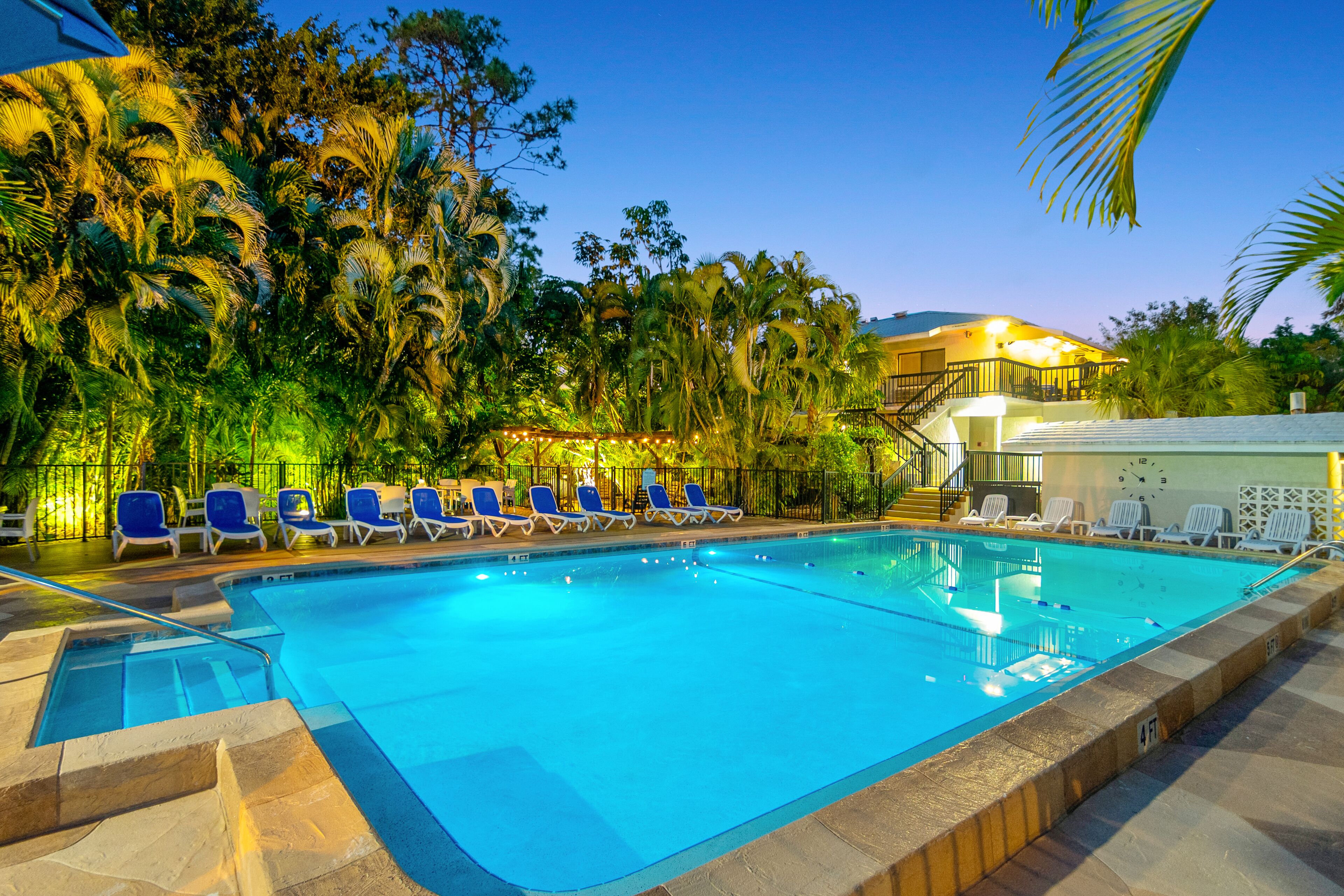 Outdoor pool, a heated pool, pool umbrellas, pool loungers
