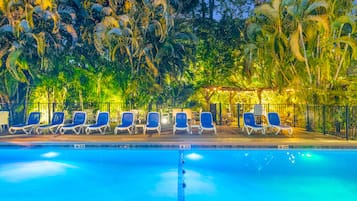 Outdoor pool, a heated pool, pool umbrellas, pool loungers