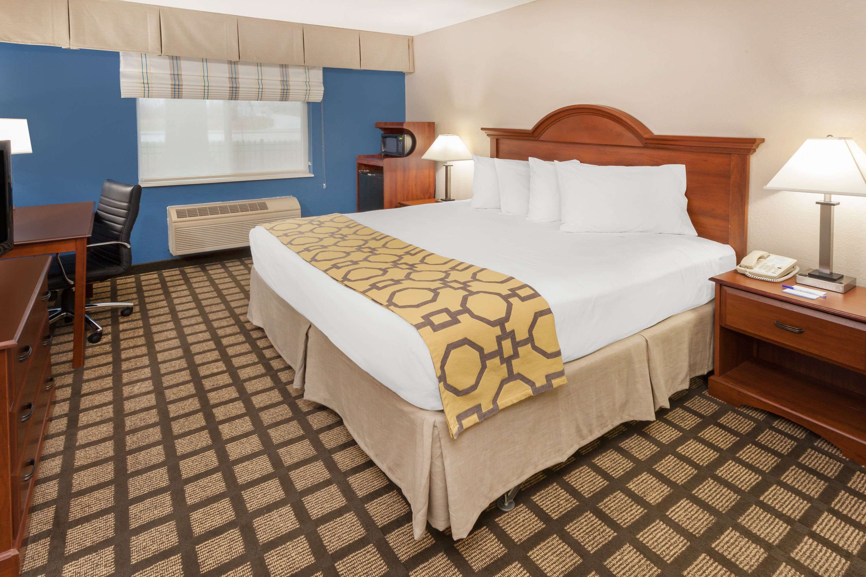 desk, laptop workspace, blackout curtains, iron/ironing board