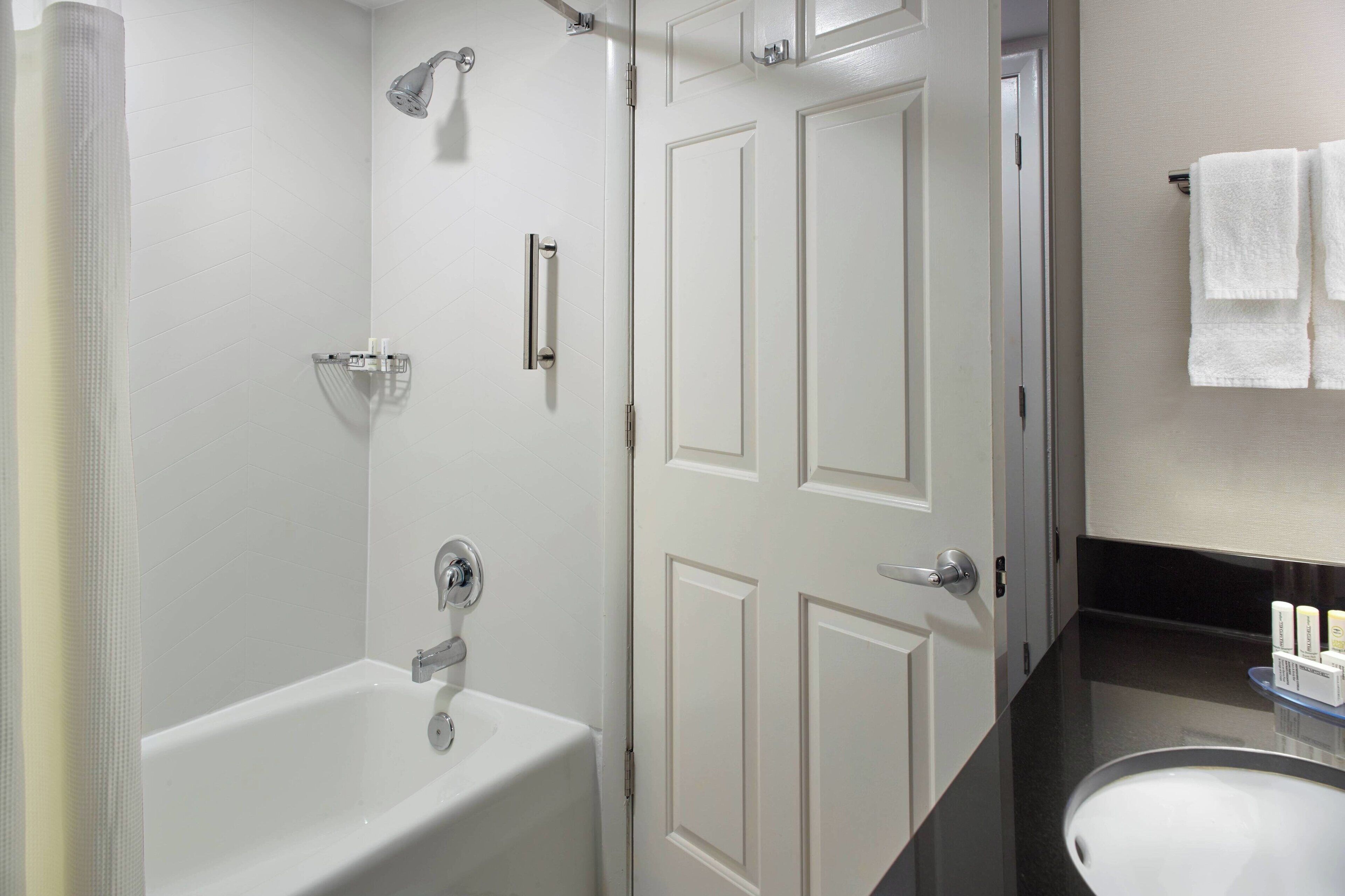 room, 2 queen beds | bathroom | combined shower/bathtub, free toiletries, hair dryer, towels