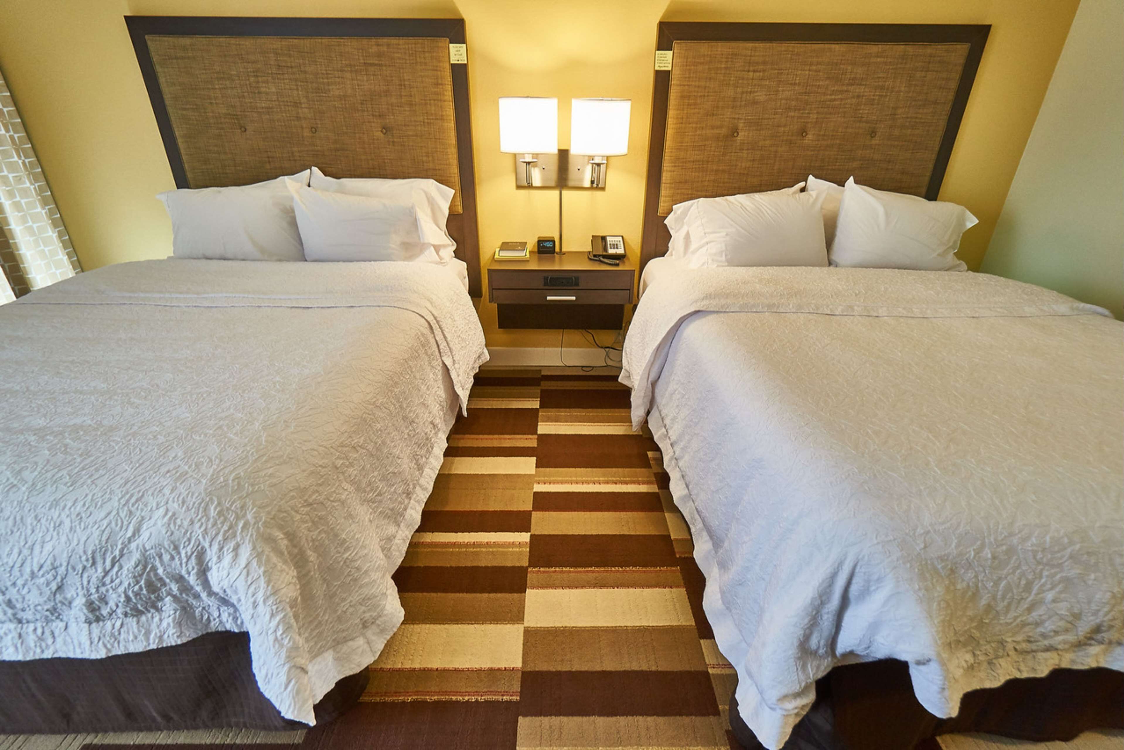 room, 2 queen beds, non smoking | in-room safe, desk, iron/ironing board, free cots/infant beds