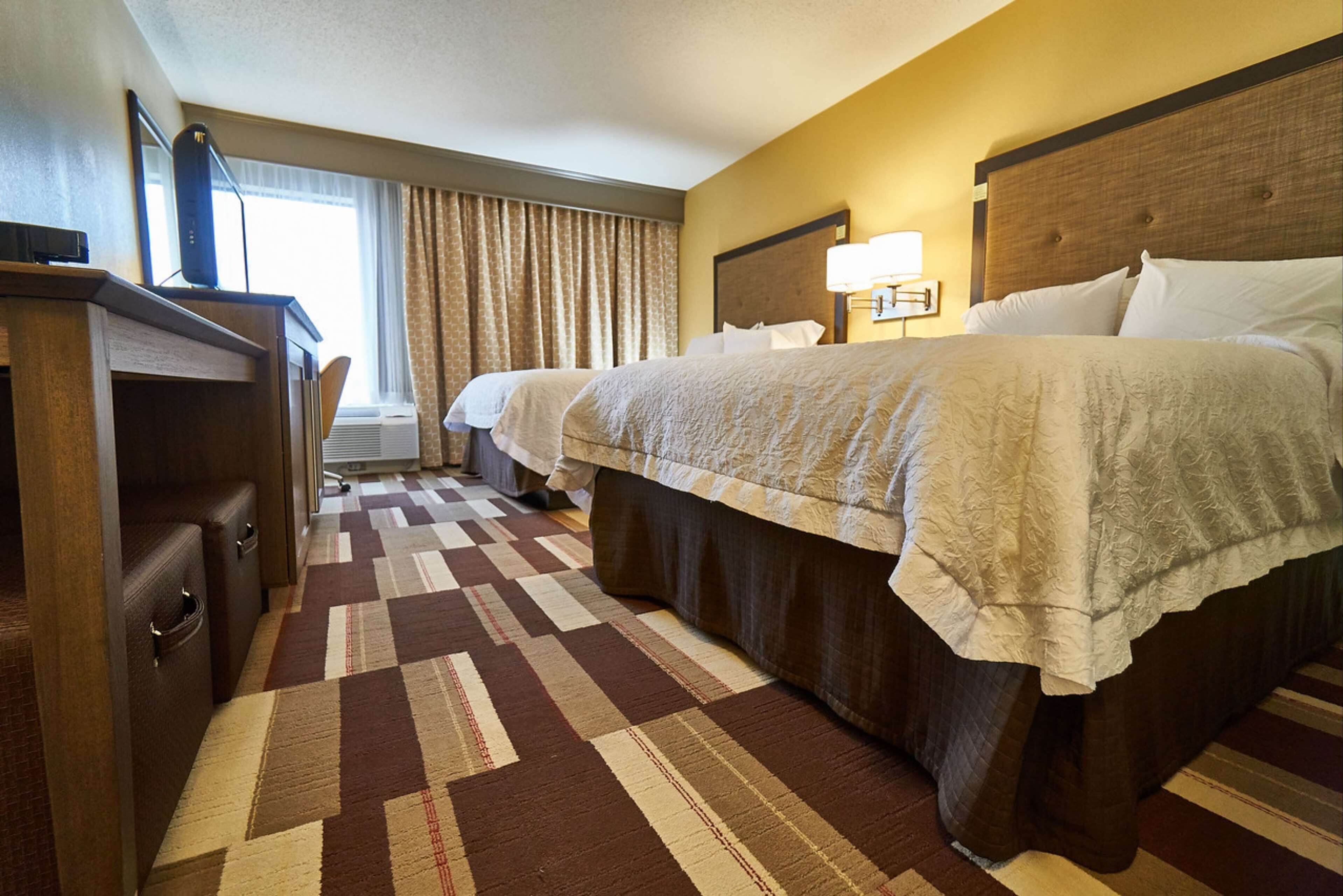 room, 2 queen beds, non smoking | in-room safe, desk, iron/ironing board, free cots/infant beds