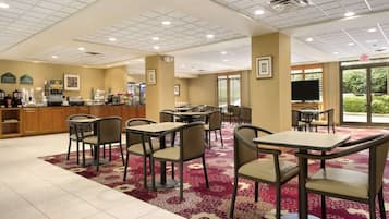 Enjoy dining and socializing in this inviting space with a variety of seating options and a fully equipped coffee station.