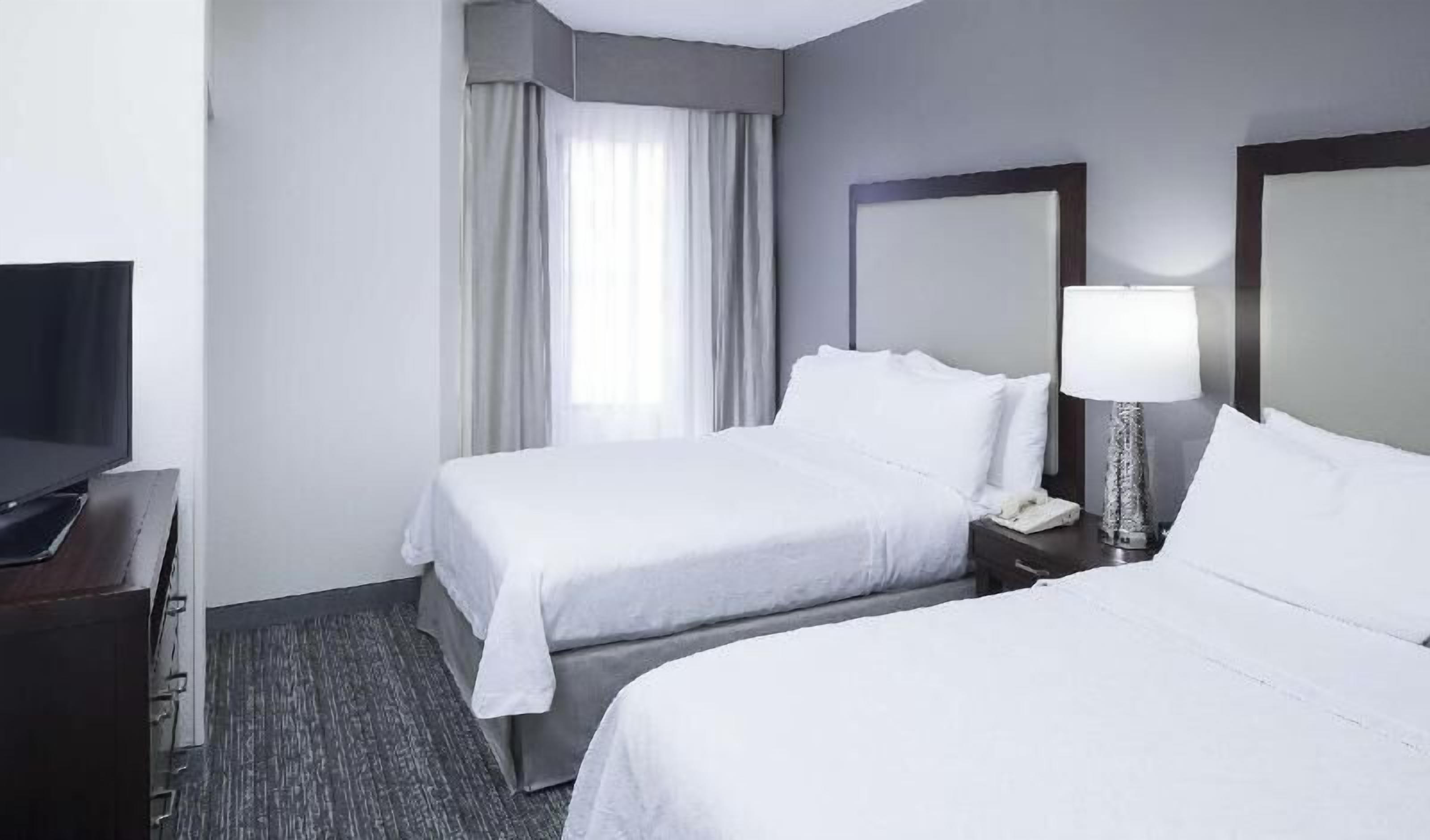 Premium bedding, desk, iron/ironing board, free cribs/infant beds