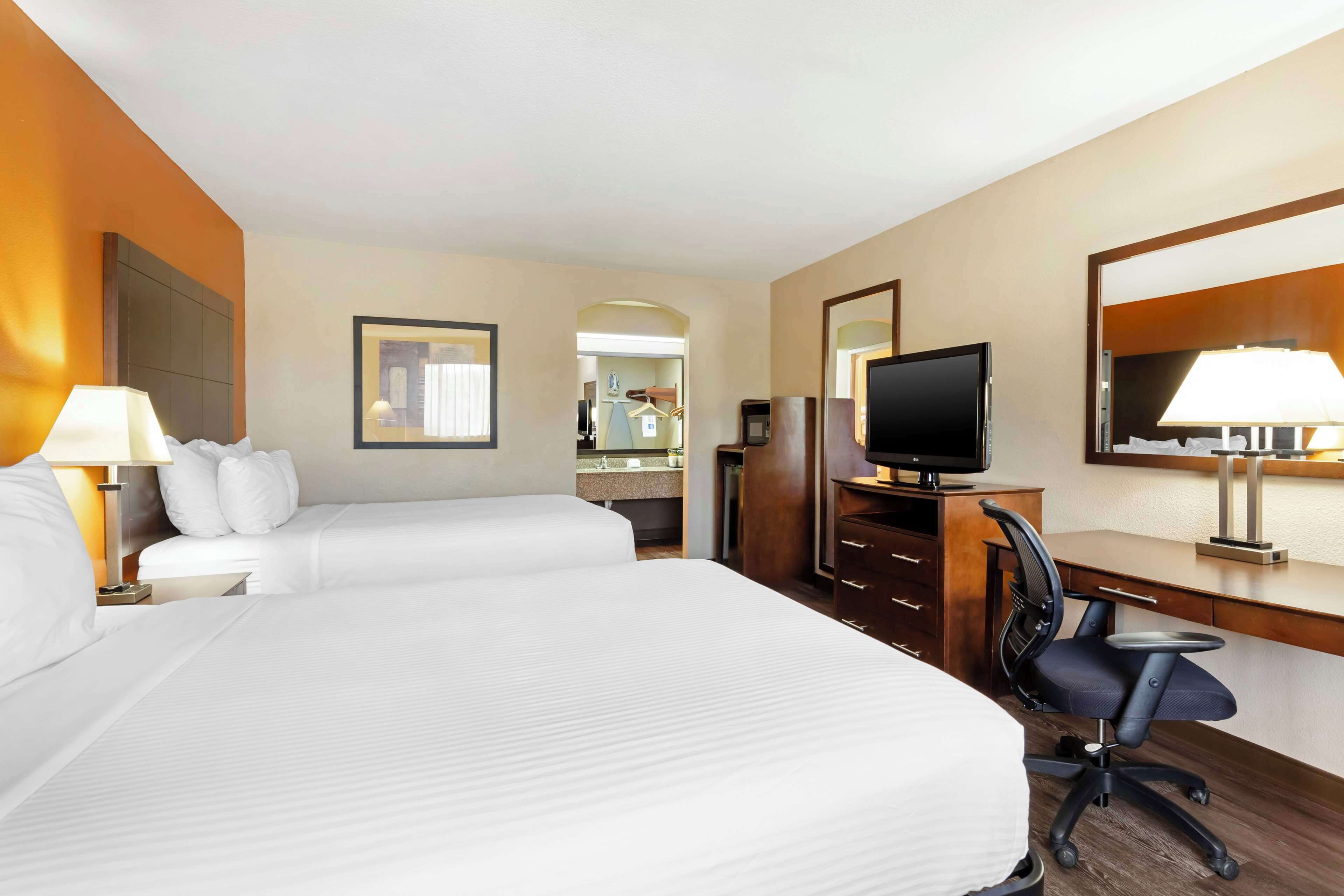 Pillowtop beds, desk, laptop workspace, blackout drapes