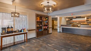 A hotel lobby with a coffee station, a snack bar, and a reception desk. - Best Western Plus Hudson I-94 (Hudson)