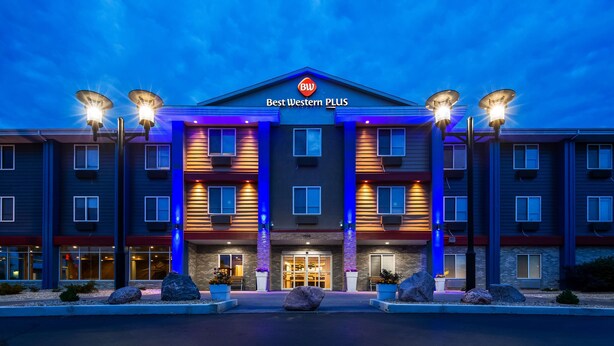 A multi-story hotel with a prominent entrance, air conditioning units, and a sign reading "Best Western PLUS". - Best Western Plus Hudson I-94 (Hudson)