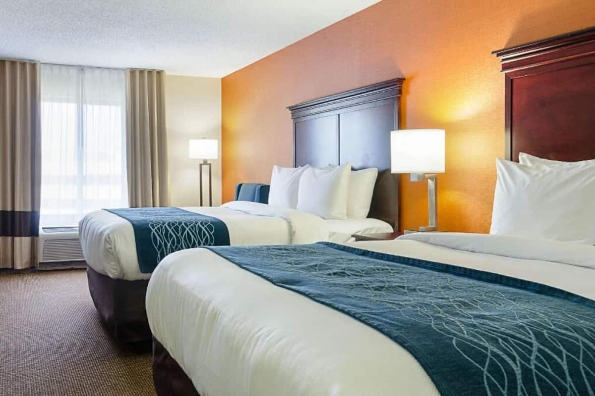 Premium bedding, desk, laptop workspace, blackout curtains