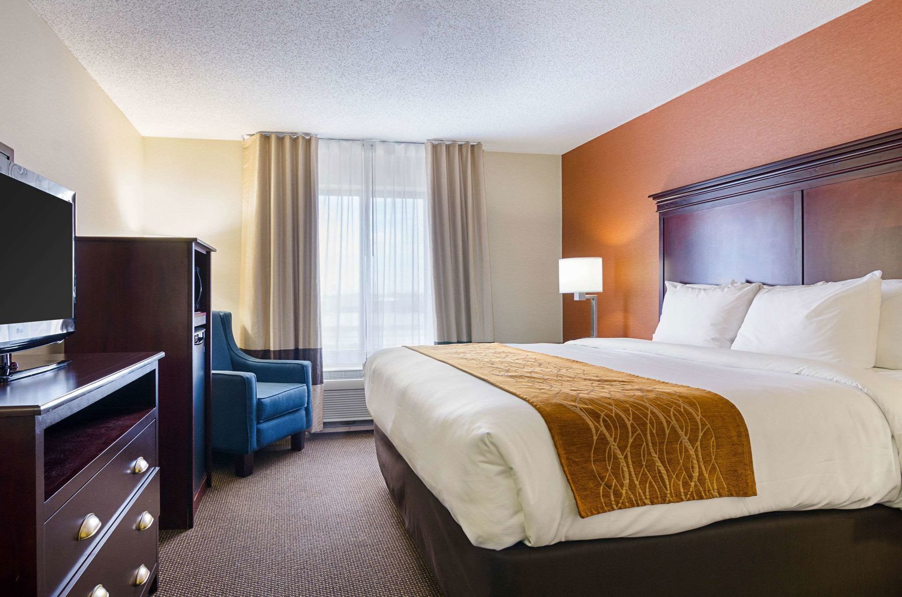 Premium bedding, desk, laptop workspace, blackout curtains