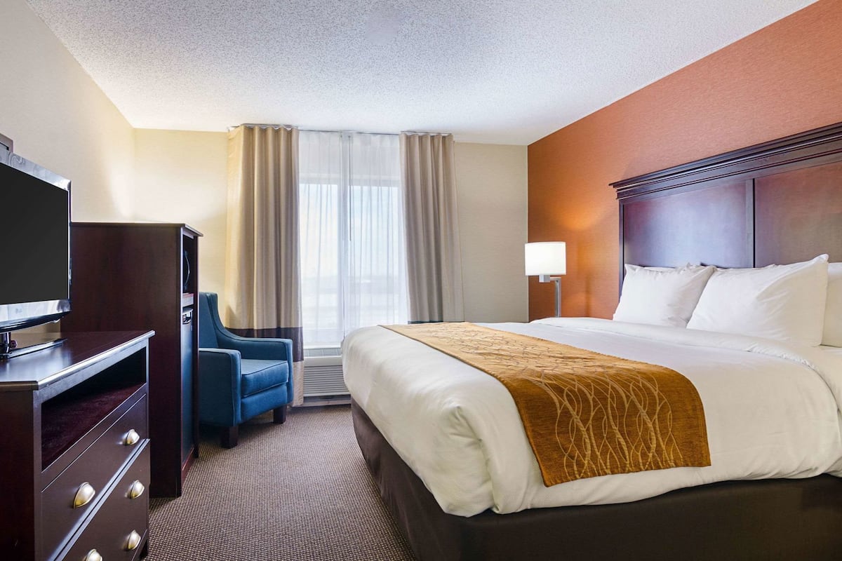 Premium bedding, desk, laptop workspace, blackout curtains