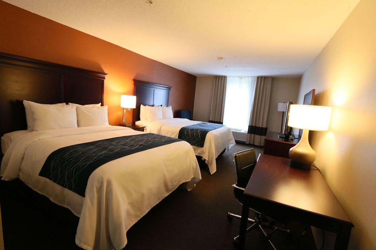 Premium bedding, desk, laptop workspace, blackout curtains