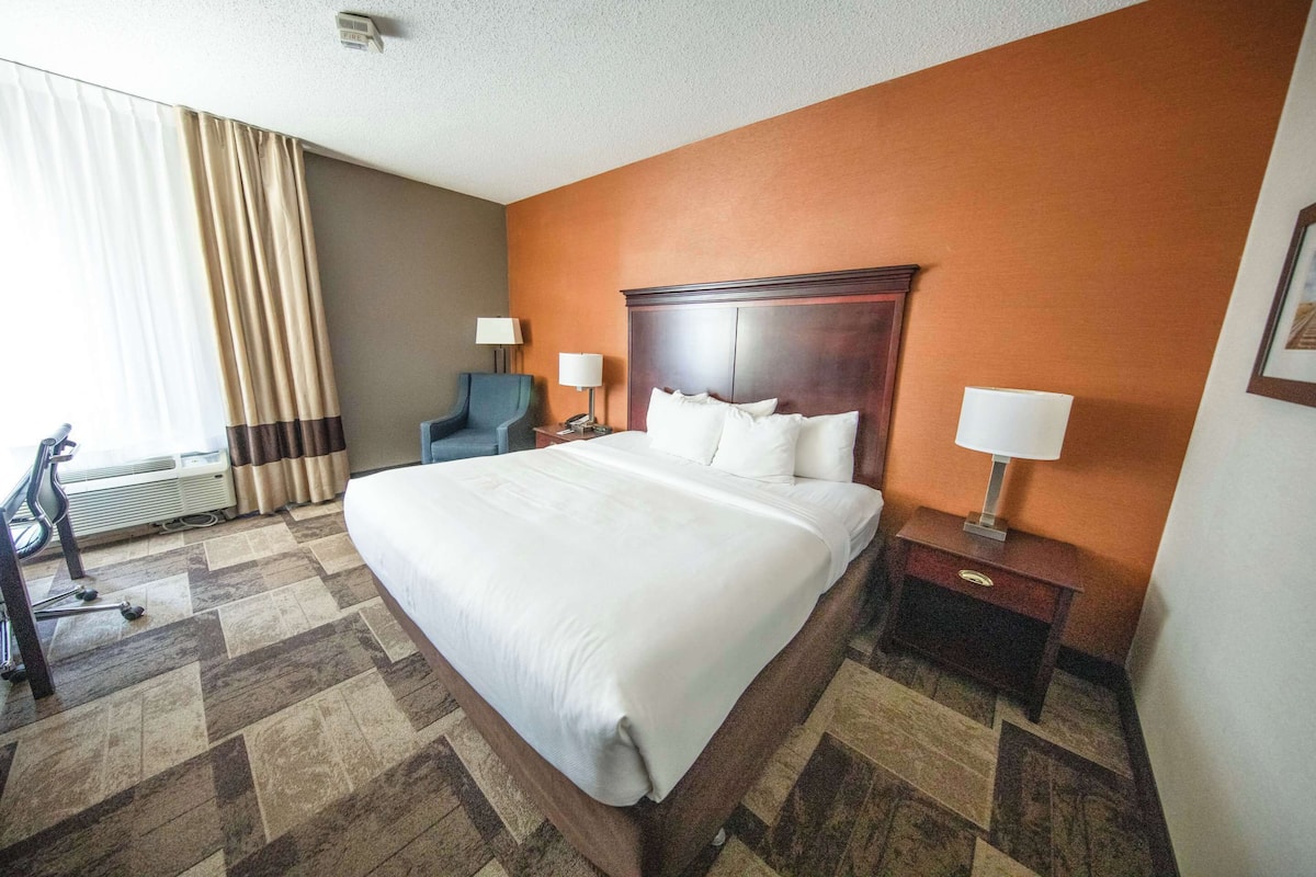 Premium bedding, desk, laptop workspace, blackout curtains