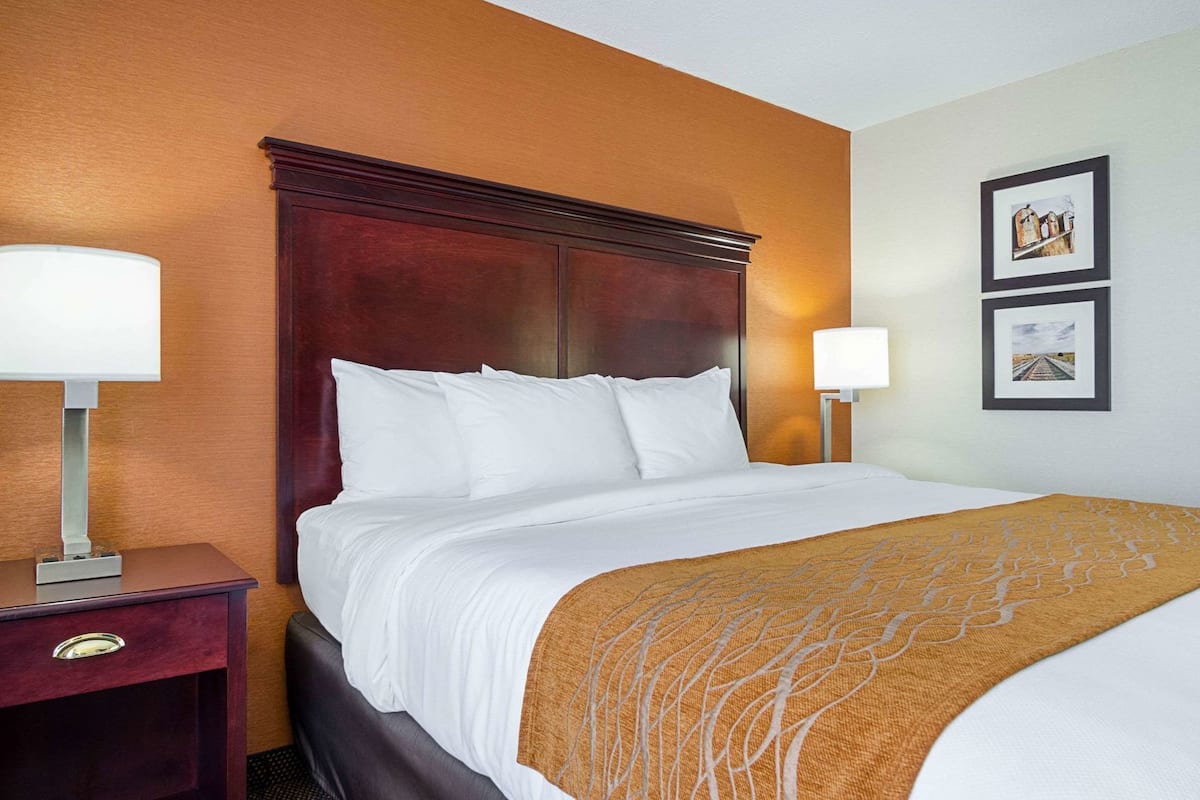 Premium bedding, desk, laptop workspace, blackout curtains