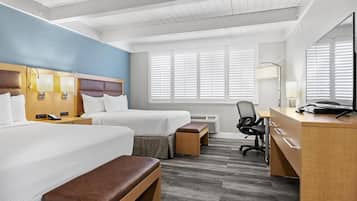 Premium bedding, desk, laptop workspace, blackout drapes