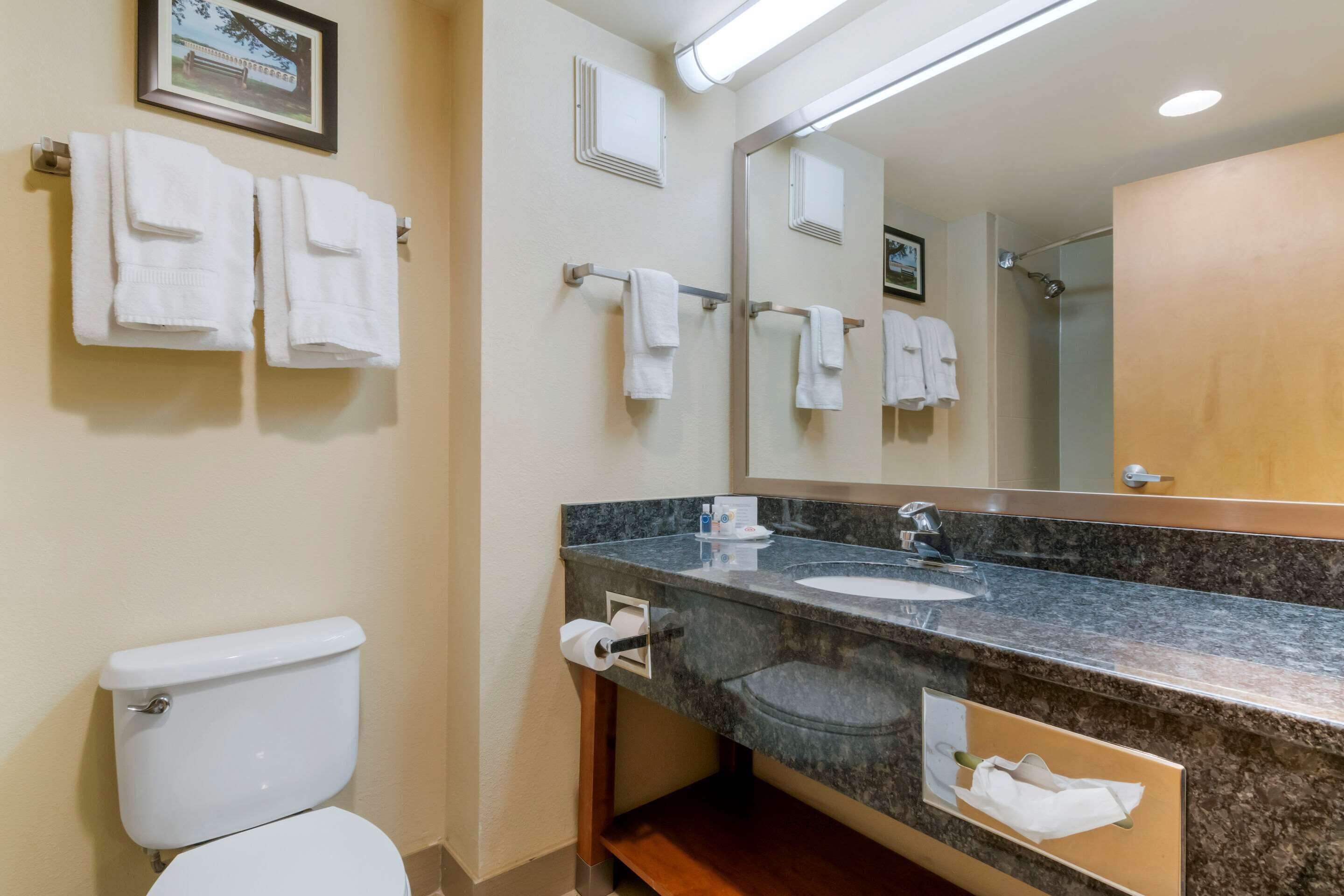 standard room, 2 queen beds, non smoking | bathroom | combined shower/bathtub, hair dryer, slippers, towels