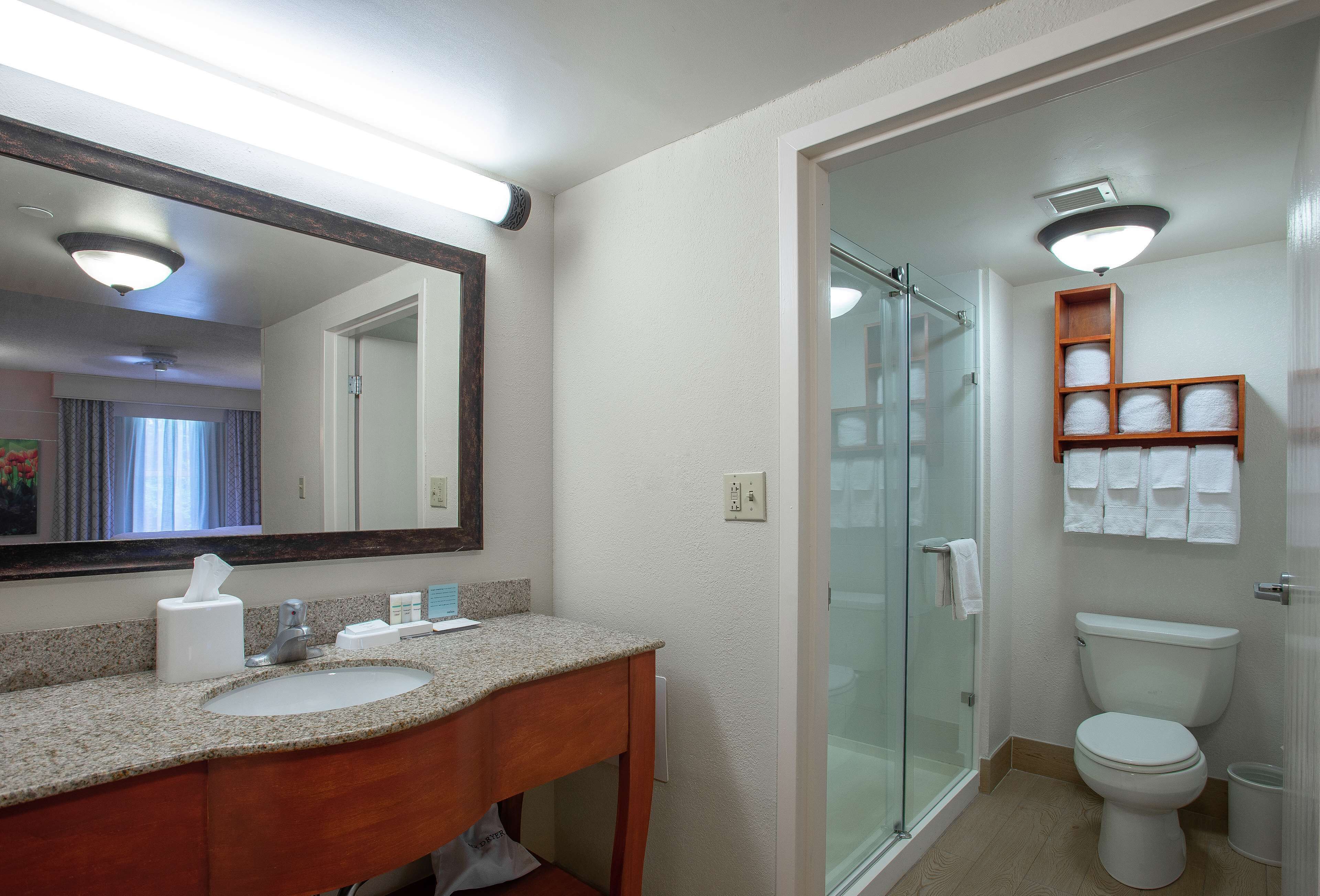 signature suite, multiple beds | bathroom | free toiletries, hair dryer, towels, soap