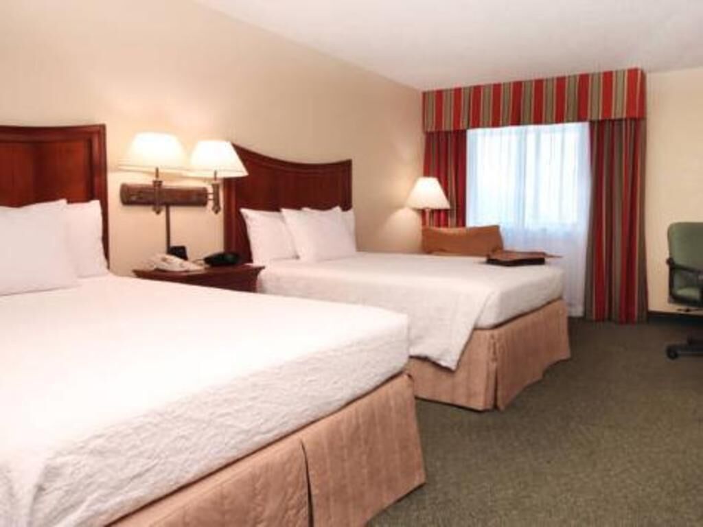 Premium bedding, laptop workspace, iron/ironing board