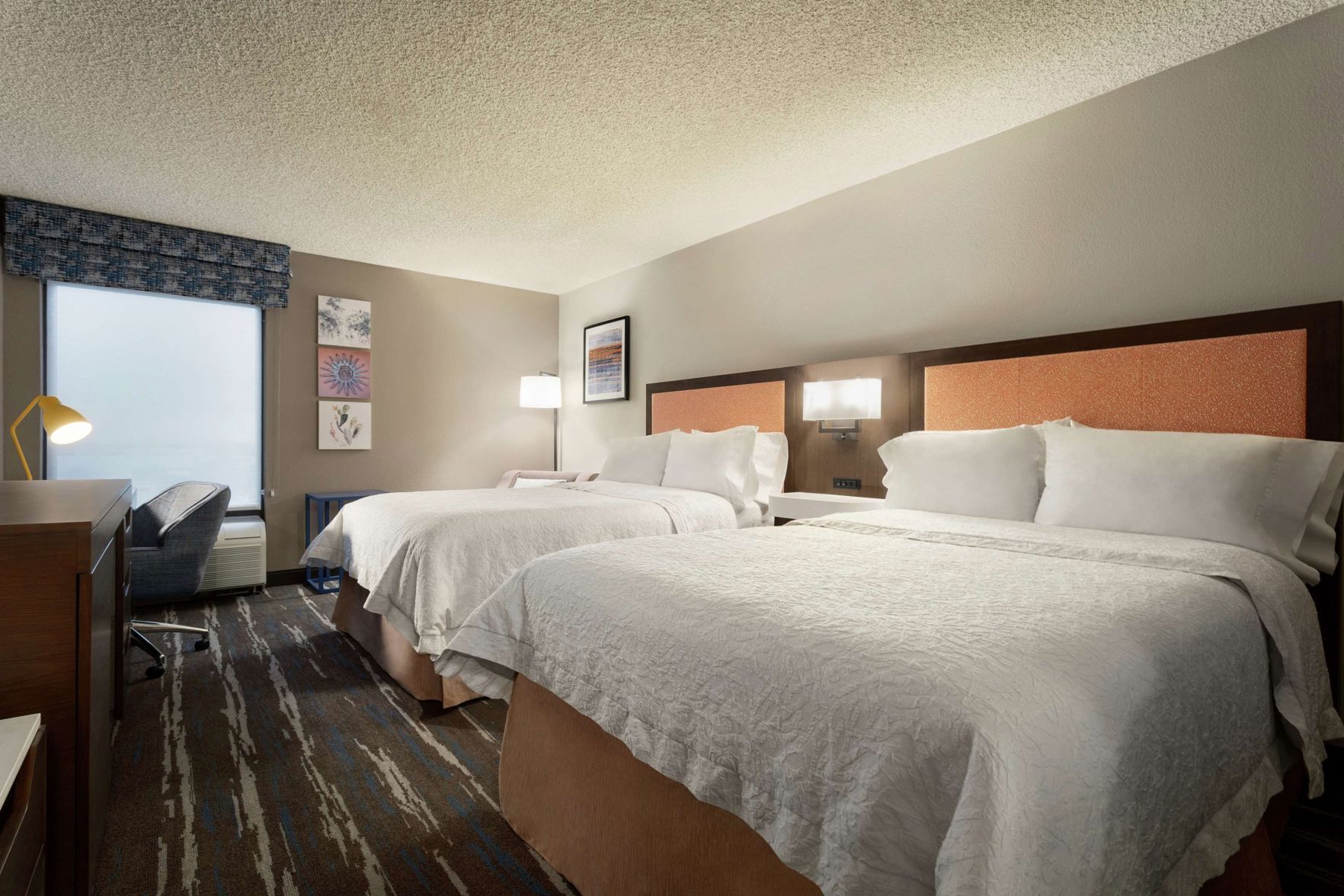 Premium bedding, laptop workspace, iron/ironing board