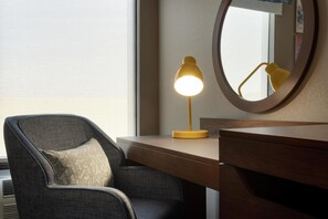 Premium bedding, laptop workspace, iron/ironing board