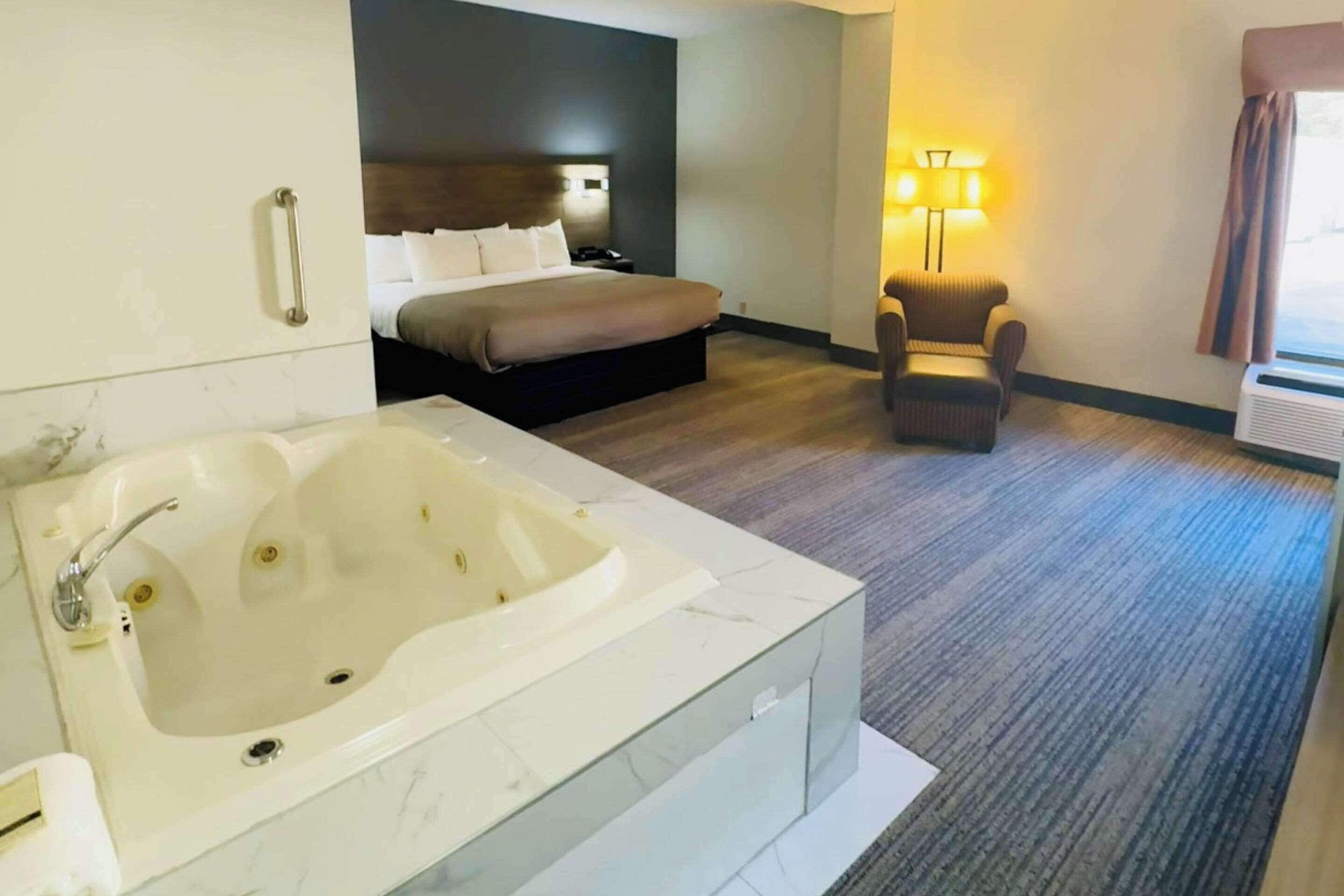 Desk, laptop workspace, blackout drapes, iron/ironing board