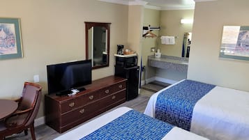 Desk, laptop workspace, iron/ironing board, free cribs/infant beds