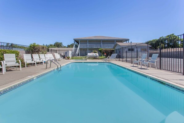 Seasonal outdoor pool, open 10 AM to 10 PM, pool umbrellas