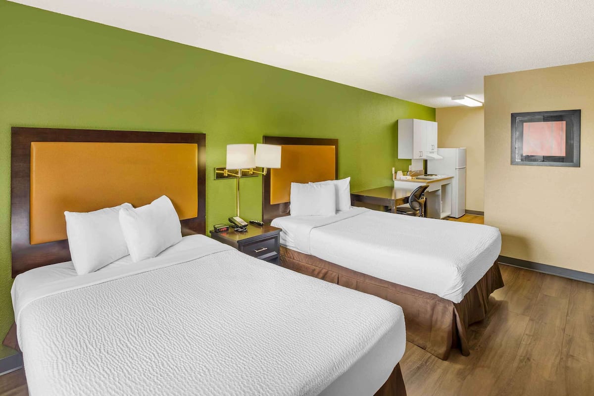 Desk, blackout drapes, iron/ironing board, rollaway beds