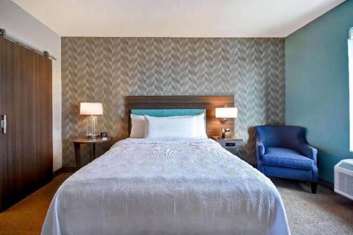 Premium bedding, blackout drapes, iron/ironing board, bed sheets