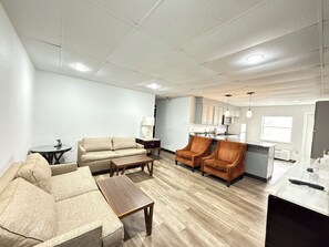 Suite, 1 King Bed with Sofa bed, Non Smoking | Living area | 55-inch flat-screen TV with cable channels, TV