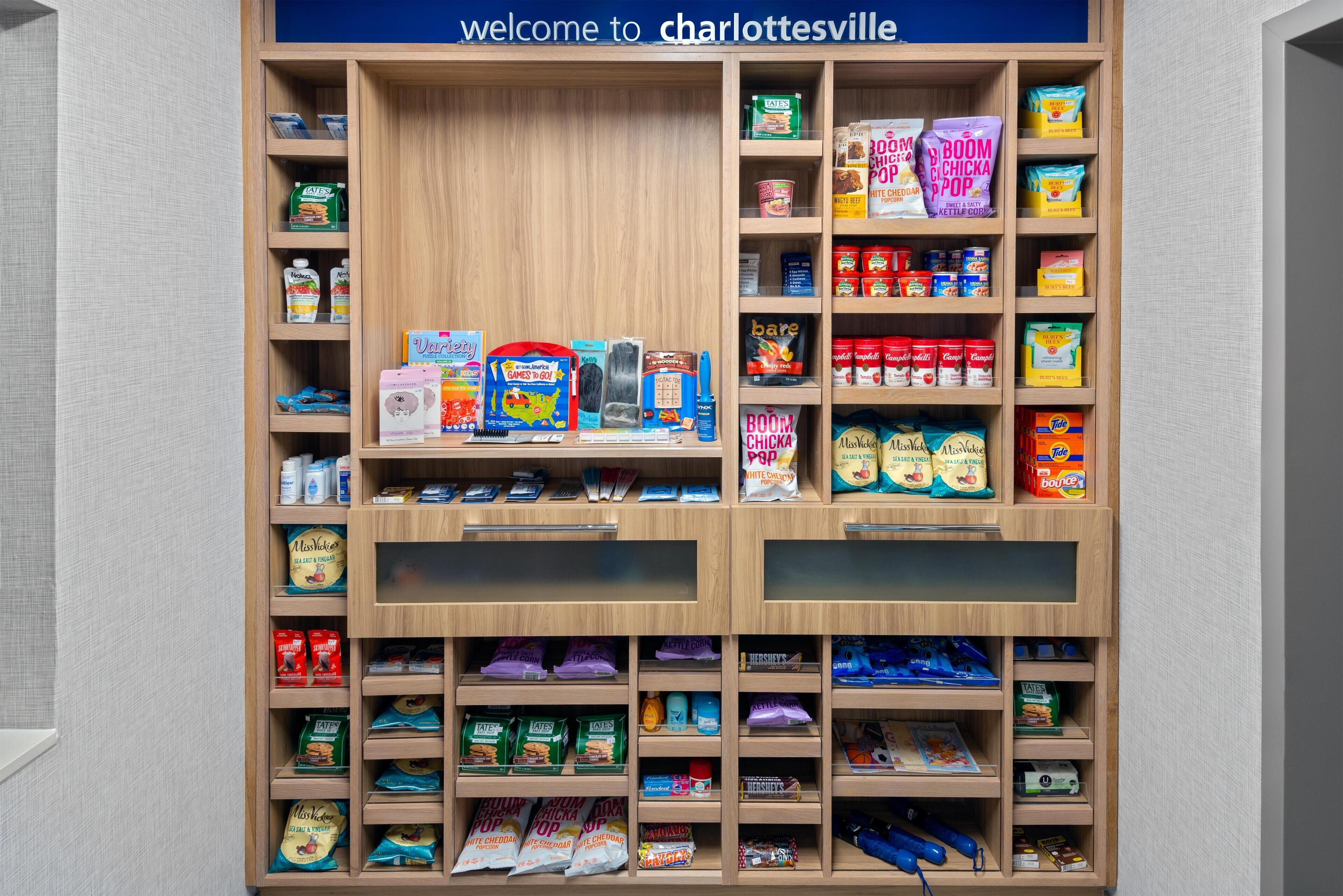 A well-organized pantry with various food items and household goods.