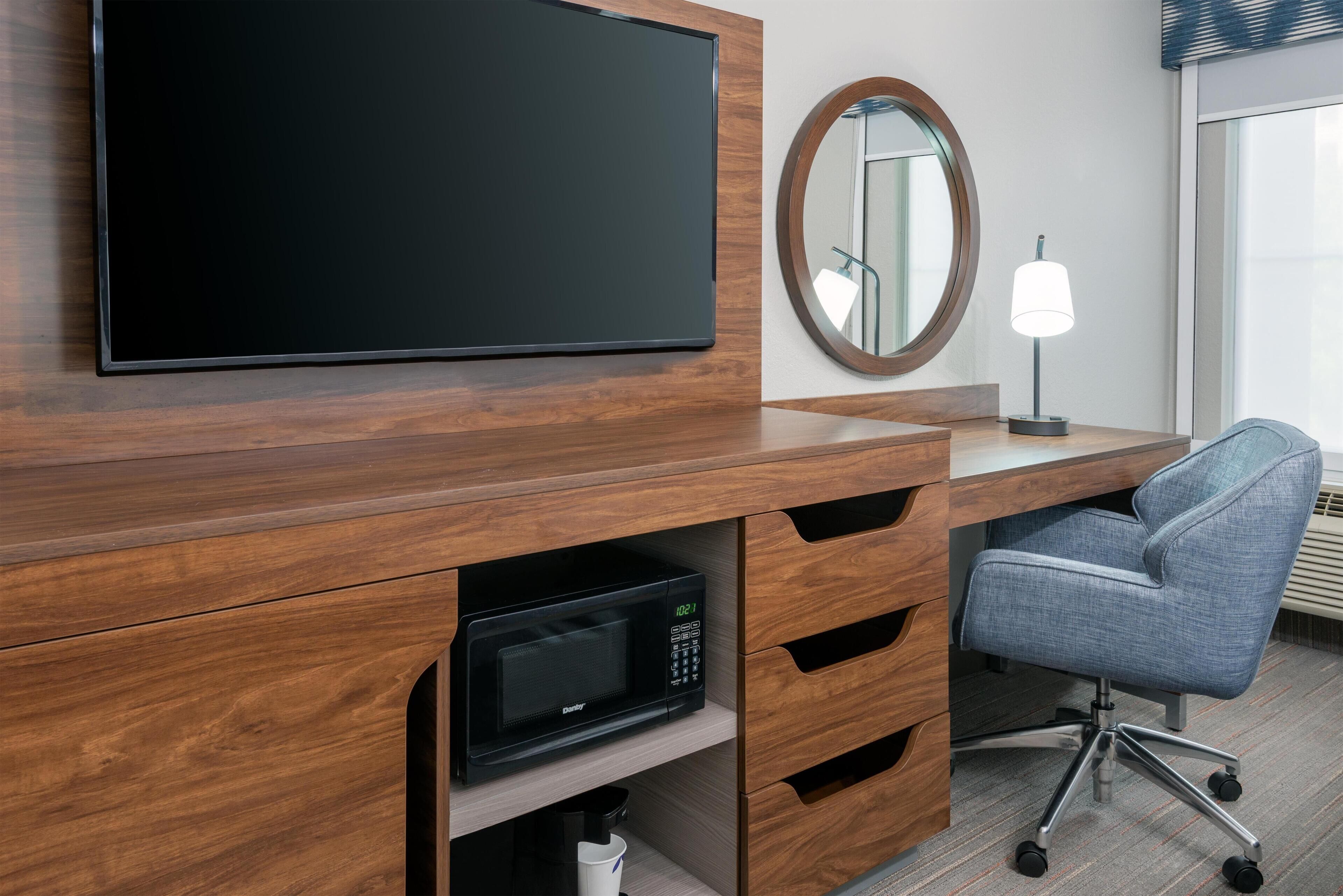 Premium bedding, desk, laptop workspace, iron/ironing board