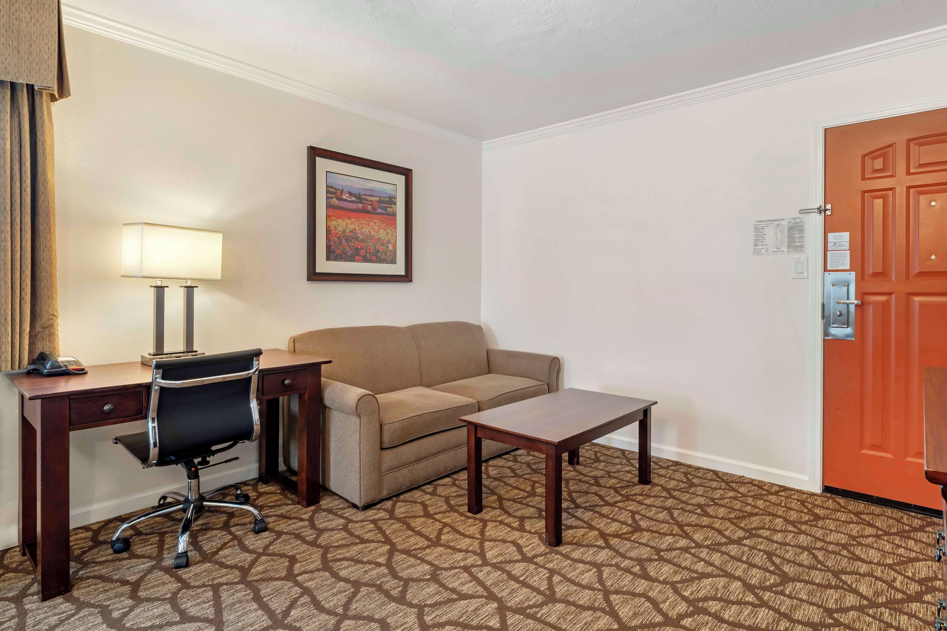 standard room, 1 king bed, refrigerator & microwave (larger room) | 1 bedroom, laptop workspace, iron/ironing board, cots/infant beds