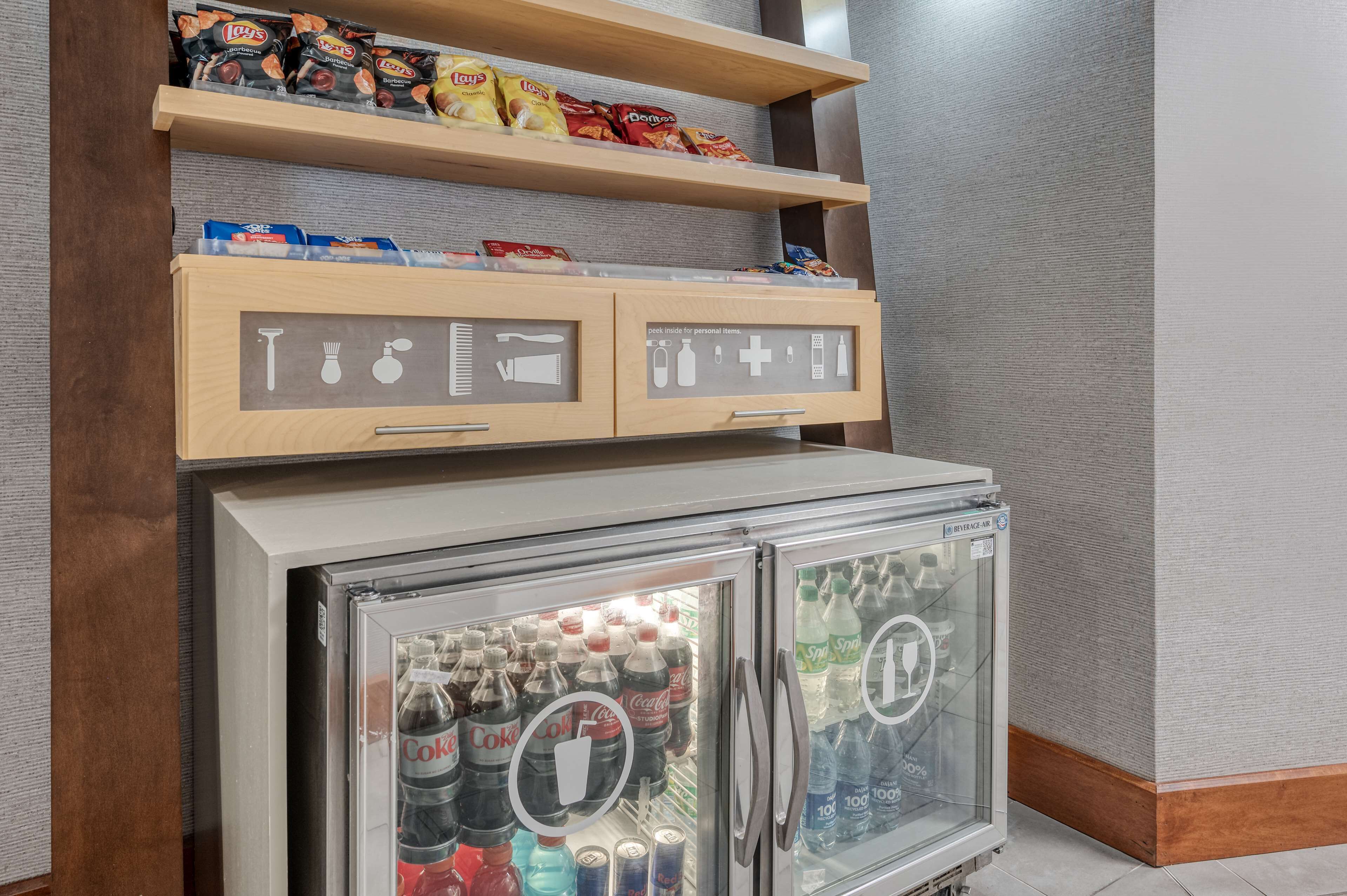 A minibar with snacks and a beverage cooler.