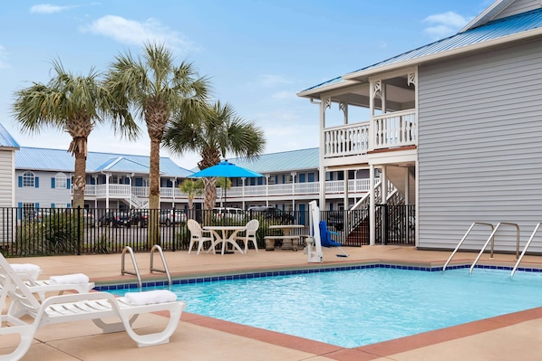 Seasonal outdoor pool, pool umbrellas, pool loungers