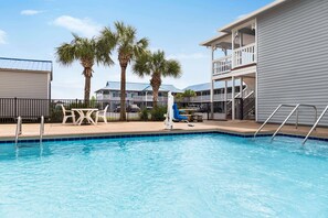 Seasonal outdoor pool, open 9:00 AM to 10:00 PM, pool umbrellas