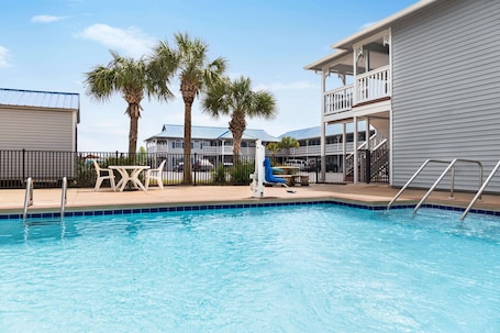 Seasonal outdoor pool, open 9:00 AM to 10:00 PM, pool umbrellas. Super 8 by Wyndham Foley